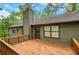Exterior view of a home with a spacious wooden deck and an access door at 4788 Rock Island Nw Ln, Acworth, GA 30102