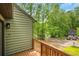 This cozy front deck offers a charming view of the wooded neighborhood street at 4788 Rock Island Nw Ln, Acworth, GA 30102