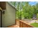 This cozy front deck offers a charming view of the wooded neighborhood street at 4788 Rock Island Nw Ln, Acworth, GA 30102