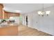Cozy kitchen features wood cabinets, modern appliances, stone countertops, and wood flooring at 4788 Rock Island Nw Ln, Acworth, GA 30102