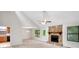 Spacious living room with vaulted ceilings, stone fireplace, neutral carpet and paint at 4788 Rock Island Nw Ln, Acworth, GA 30102