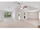 Open living area with vaulted ceilings, ceiling fan, neutral colors, and lots of natural light at 4788 Rock Island Nw Ln, Acworth, GA 30102