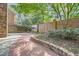 Backyard with a brick paver patio and lush landscaping at 12 Westchester Square Sq, Decatur, GA 30030