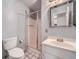 Bathroom featuring a vanity, toilet, and shower with glass door at 12 Westchester Square Sq, Decatur, GA 30030