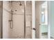 Bathroom with white tile shower, glass door, and a small vanity at 12 Westchester Square Sq, Decatur, GA 30030