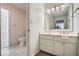 Bathroom featuring a marble top vanity with a white towel and a tiled floor at 12 Westchester Square Sq, Decatur, GA 30030
