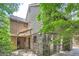 Exterior of home with brick and wood siding surrounded by greenery at 12 Westchester Square Sq, Decatur, GA 30030