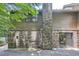 Exterior of home with brick and wood siding, and a gated entrance at 12 Westchester Square Sq, Decatur, GA 30030