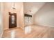 Bright foyer with wood floors, a soaring ceiling, and a decorative front door at 12 Westchester Square Sq, Decatur, GA 30030