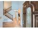 Grand foyer with hardwood floors, a staircase, and a decorative front door with leaded glass at 12 Westchester Square Sq, Decatur, GA 30030