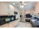 Bright kitchen featuring stainless steel appliances, black tile backsplash, and granite countertops at 12 Westchester Square Sq, Decatur, GA 30030