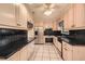 Well-lit kitchen with sleek black countertops, stainless steel appliances, and ample cabinet space at 12 Westchester Square Sq, Decatur, GA 30030