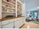 Stylish living room with built-in shelves, cabinets, and natural light at 12 Westchester Square Sq, Decatur, GA 30030