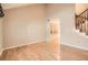 Spacious living room with wood floors, staircase, and built-in shelving at 12 Westchester Square Sq, Decatur, GA 30030