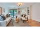 Cozy living room with a white brick fireplace, built-in shelves, and a sliding glass door at 12 Westchester Square Sq, Decatur, GA 30030