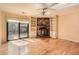 Bright living room with brick fireplace, built-in shelving and hardwood flooring at 12 Westchester Square Sq, Decatur, GA 30030