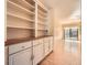 Open living room featuring built-in cabinets and a sliding glass door to a backyard area at 12 Westchester Square Sq, Decatur, GA 30030
