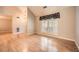 Light-filled living room with wood floors, a large window, and a high ceiling at 12 Westchester Square Sq, Decatur, GA 30030