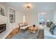 Inviting living room with a white brick fireplace, hardwood floors, and stylish furnishings at 12 Westchester Square Sq, Decatur, GA 30030