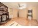 Bright living room features a brick fireplace, hardwood floors, and natural light at 12 Westchester Square Sq, Decatur, GA 30030