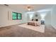 Light-filled main bedroom featuring carpet flooring, a ceiling fan, and windows with bright lighting at 12 Westchester Square Sq, Decatur, GA 30030