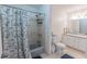 Bathroom featuring shower/tub combo with patterned curtain, toilet, sink and vanity at 150 Newton Ridge Dr, Covington, GA 30014