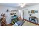 Cozy bedroom with ceiling fan, hardwood floors, reptile tank, and wildlife decor at 150 Newton Ridge Dr, Covington, GA 30014