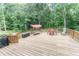 The deck features outdoor furniture, a grill, and plenty of room for Gathering activities at 150 Newton Ridge Dr, Covington, GA 30014