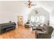 Bright living room features vaulted ceilings, wood floors, a cozy gray couch, and a decorative deer head mount at 150 Newton Ridge Dr, Covington, GA 30014