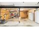 Unfinished basement with an exercise bike, storage shelves, and a fridge at 1534 September Chase, Decatur, GA 30033