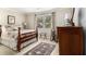 Cozy bedroom with a large window, detailed rug, and traditional furnishings at 1534 September Chase, Decatur, GA 30033