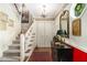 Inviting entryway with hardwood floors, staircase, and decorative accents at 1534 September Chase, Decatur, GA 30033