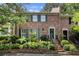 Charming brick townhouse with green shutters and meticulously landscaped front yard at 1534 September Chase, Decatur, GA 30033