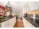 Bright kitchen featuring granite counters, stainless steel sink, and hardwood floors at 1534 September Chase, Decatur, GA 30033