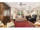 Cozy living room featuring a vintage armoire, patterned rug, and comfortable seating at 1534 September Chase, Decatur, GA 30033