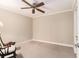 Neutral room with carpet flooring, a ceiling fan, and a vintage rocking chair at 1534 September Chase, Decatur, GA 30033