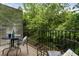 Relaxing balcony with metal railing and lattice, perfect for enjoying nature views and outdoor living at 1634 Ponce De Leon Ave # 107, Atlanta, GA 30307