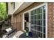 Charming balcony with outdoor seating, offering a relaxing space and natural light through the sliding glass doors at 1634 Ponce De Leon Ave # 107, Atlanta, GA 30307