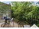 Serene balcony space offering views of lush greenery, perfect for relaxing and enjoying the outdoors at 1634 Ponce De Leon Ave # 107, Atlanta, GA 30307