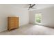 Bright, empty bedroom with a large window and carpeted floors at 1634 Ponce De Leon Ave # 107, Atlanta, GA 30307