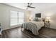 Bright bedroom with modern ceiling fan, neutral walls, and laminate floors for a comfortable retreat at 1634 Ponce De Leon Ave # 107, Atlanta, GA 30307
