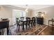 Dining room featuring a bay window, wooden table, and a decorative rug at 1634 Ponce De Leon Ave # 107, Atlanta, GA 30307