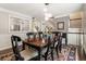Dining room with decorative rug, a view to the staircase and kitchen, and stylish lighting at 1634 Ponce De Leon Ave # 107, Atlanta, GA 30307