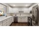 Modern kitchen featuring white cabinets, stainless steel appliances, and beautiful countertops at 1634 Ponce De Leon Ave # 107, Atlanta, GA 30307