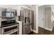 Well-equipped kitchen with stainless steel appliances, white cabinets, and modern finishes at 1634 Ponce De Leon Ave # 107, Atlanta, GA 30307