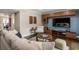 This open living space features modern built-ins, a hardwood floor, and access to the dining room at 1634 Ponce De Leon Ave # 107, Atlanta, GA 30307