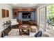 The living room boasts a view of the outdoor balcony, with a modern entertainment center and comfortable furnishings at 1634 Ponce De Leon Ave # 107, Atlanta, GA 30307