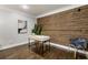 This office showcases a desk with a modern chair and a unique wooden accent wall at 1634 Ponce De Leon Ave # 107, Atlanta, GA 30307