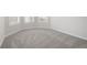 Bright bedroom with gray carpet and white trim at 306 Rodeo Dr, Auburn, GA 30102