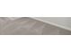 Close-up of plush gray carpet with white baseboards along the gray walls at 306 Rodeo Dr, Auburn, GA 30102